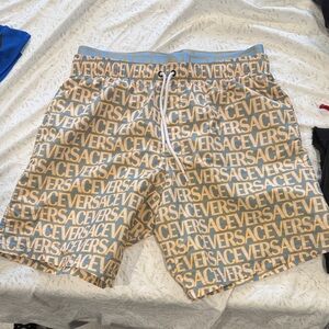 Versace Repeating Logo Swim Trunks in Tan & Blue